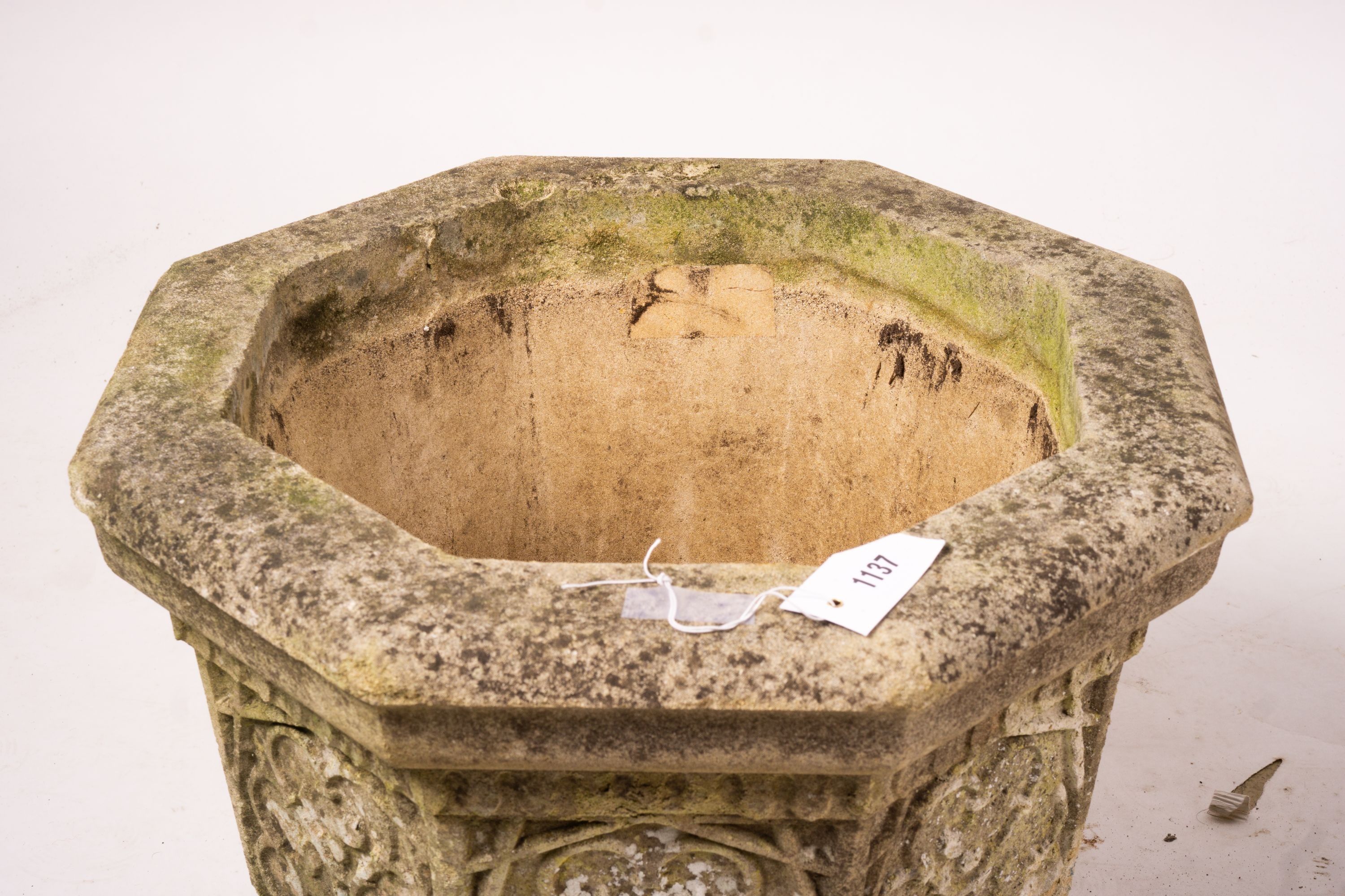 A pair of octagonal reconstituted stone garden planters, width 48cm, height 42cm